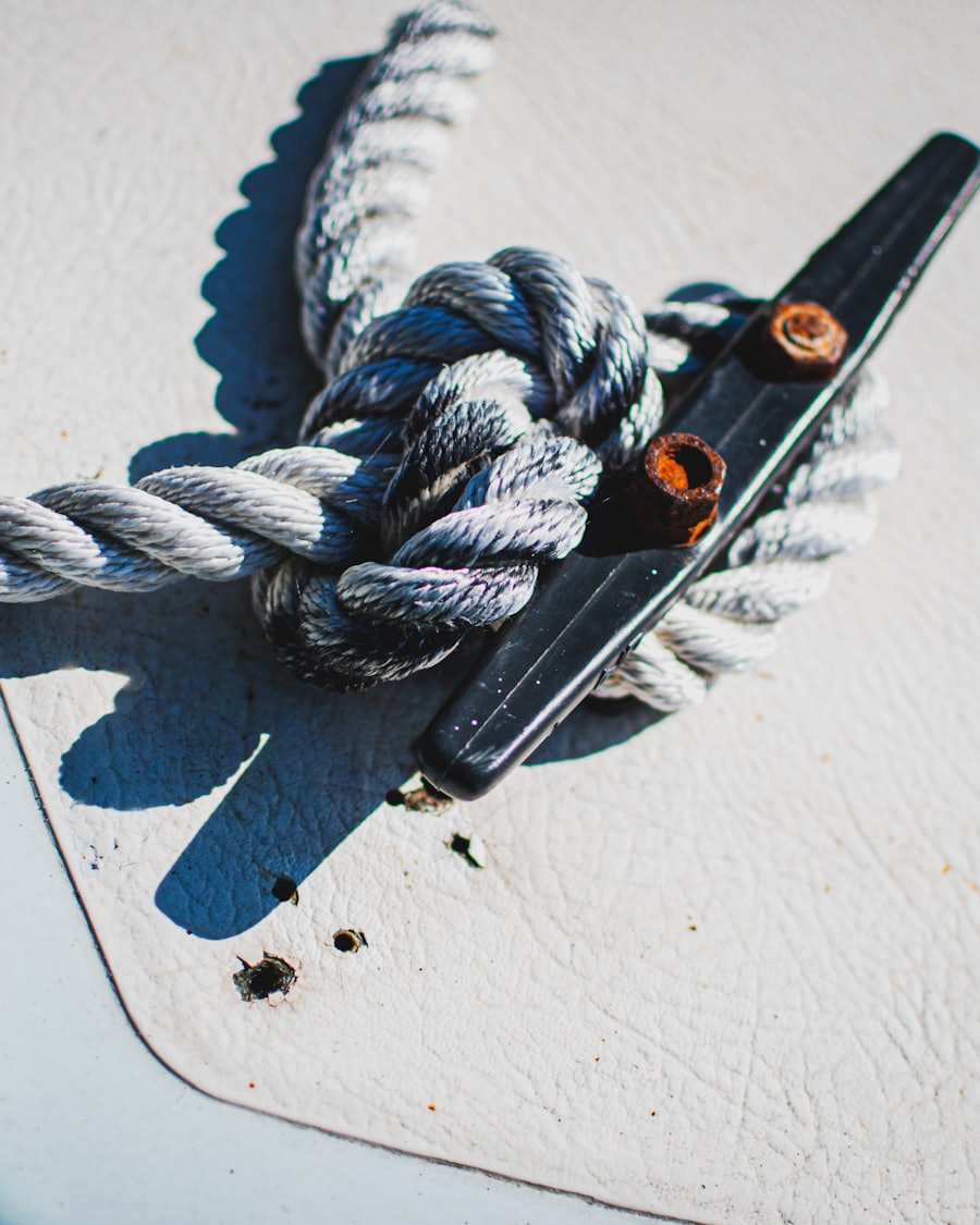 Dock line tied off on a cleat on a boat deck