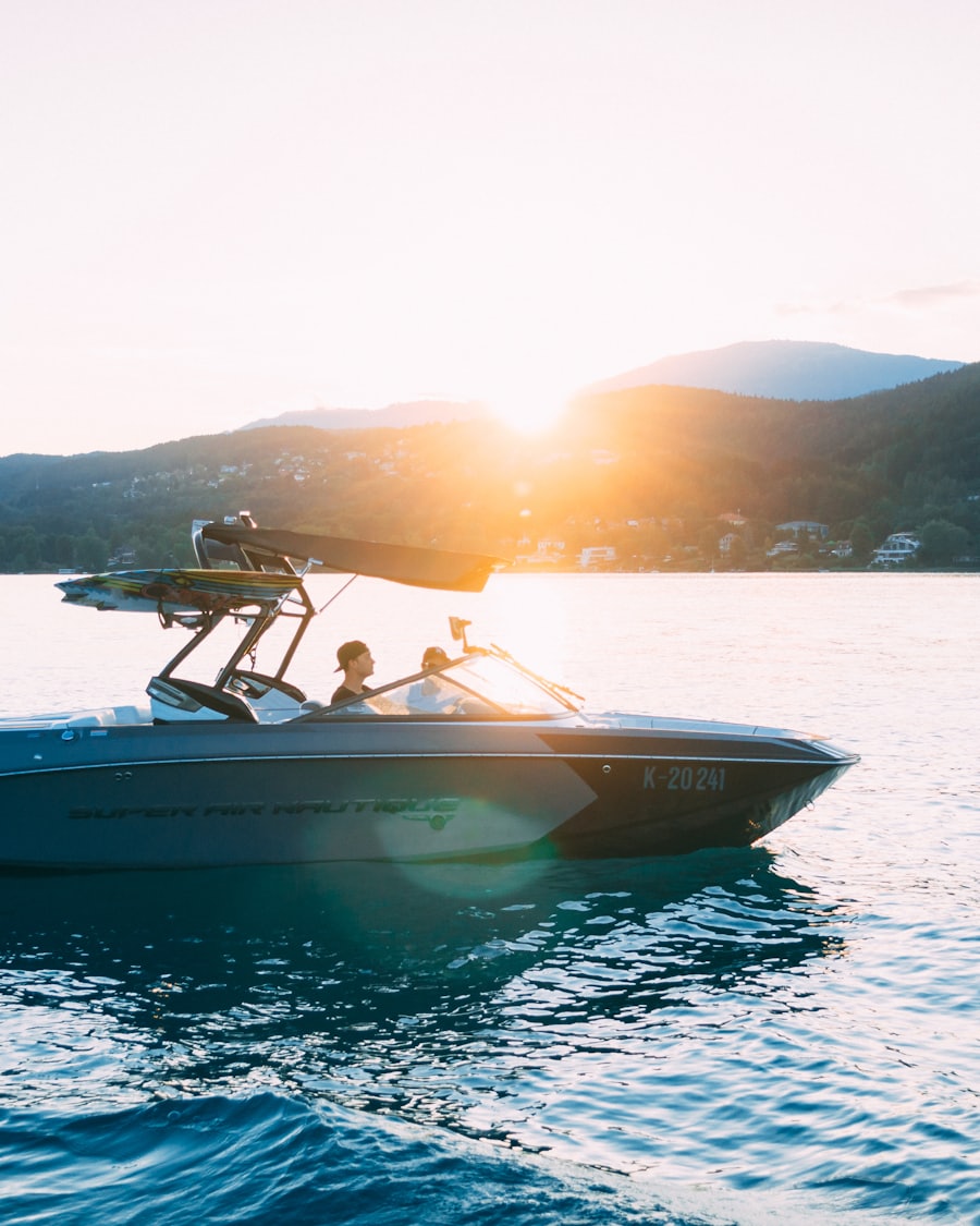 Small motorboat idling across calm water at golden hour